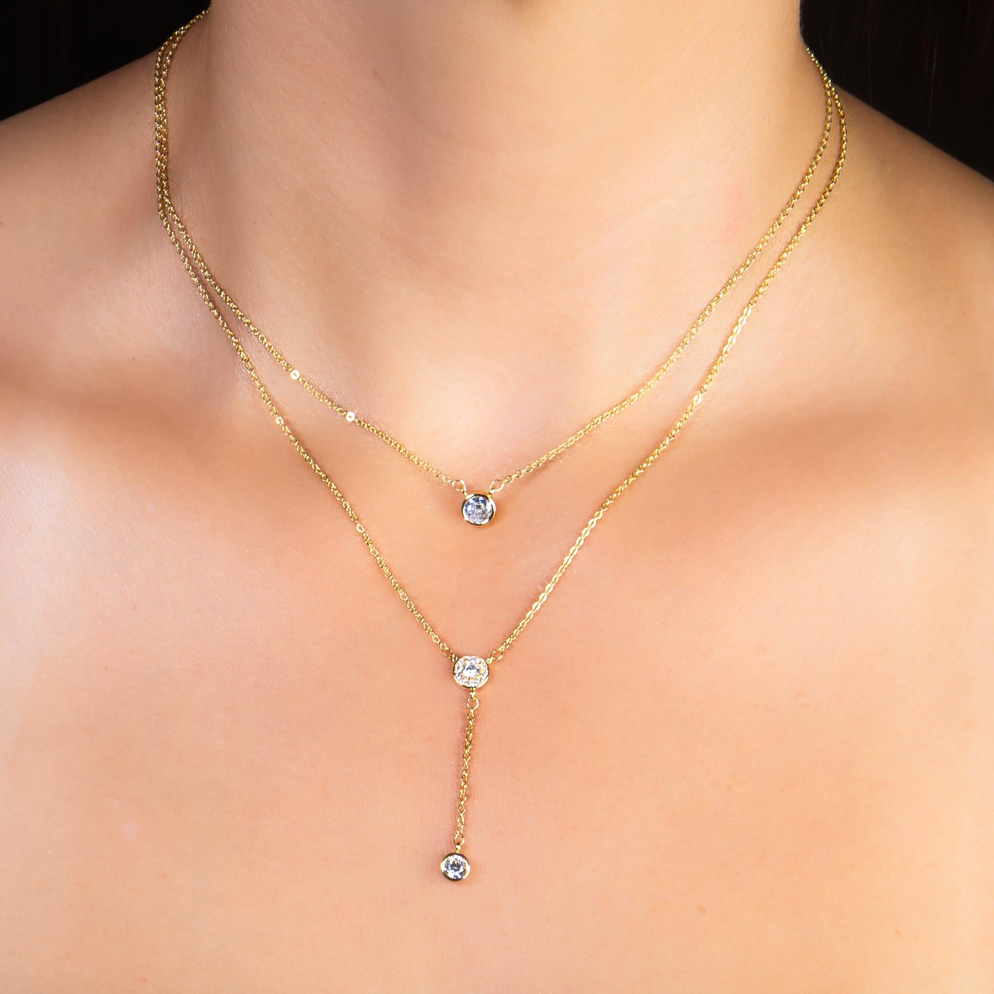 Collar y aretes dorado doble zirconias biseladas
